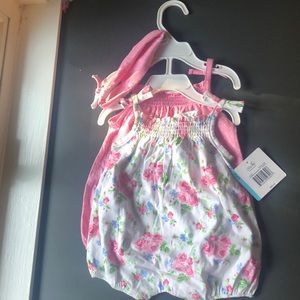 Never got the chance to put on. Cute 6 month infant romper/dress+ headband.
